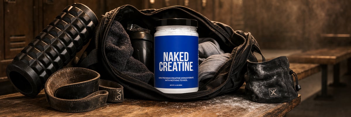 Naked Creatine tub in open gym bag on locker room bench with workout gear