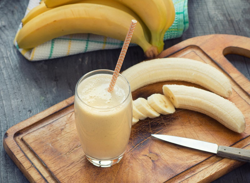 banana whey protein shake in glass 