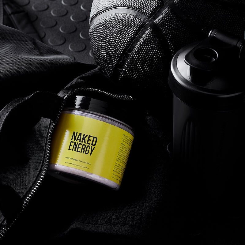 Product image of Naked Energy next to a black gym bag